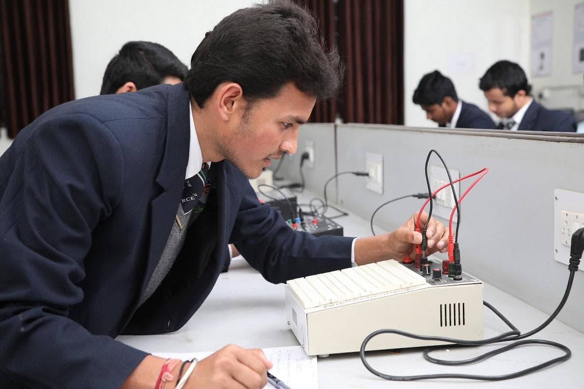 Student working with electronic equipment